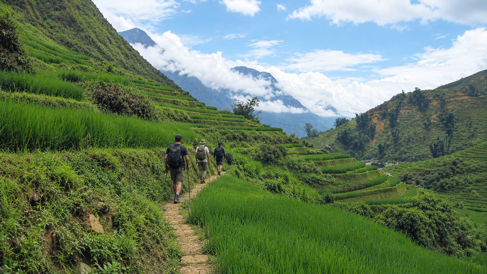 Three travelers walking along a mountain trail beside green rice terraces in Hoang Su Phi, Vietnam